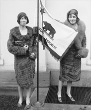 Two Young Women Presenting California State Flag to U.S. President Herbert Hoover, Washington DC, USA, National Photo Company, March 1929