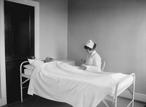 Nurse Checking Patient's Pulse Rate in Hospital, USA, National Photo Company, 1922