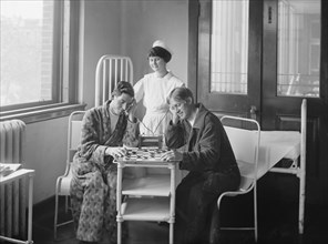 Two Patients Listening to Radio while Playing Checkers, Garfield Hospital, Washington DC, USA, National Photo Company, 1924