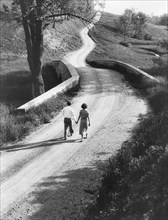 Rear View Portrait of Couple Walking Down Rural Road, Pennsylvania, USA, Philip D. Gendreau for Farm Security Administration, 1930