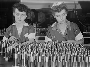 Two Female Workers Inspecting Airplane Motor Parts during World War II, USA, Ann Rosener for Office of War Information, August 1942