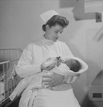 Nurse Feeding Newborn Baby, Fritz Henle for Office of War Information, November 1942