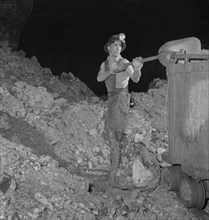 Worker Loading Zinc Ore in Mine to be used for many Purposes in the War Effort, near Cardin, Oklahoma, USA, Fritz Henle for Office of War Information, January 1943