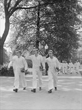 Saluting Midshipmen, U.S. Naval Academy, Annapolis, Maryland, USA, by Lieutenant Whitman for Office of War Information, July 1942