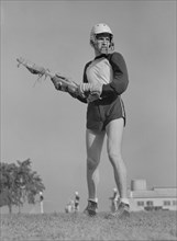 Lacrosse Player, U.S. Naval Academy, Annapolis, Maryland, USA, by Lieutenant Whitman for Office of War Information, July 1942