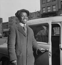 Taxi Driver Opening Door, New York City, New York, USA, Albert Fenn for Office of War Information, July 1942