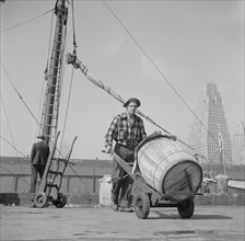 Dock Stevedore Moving Barrel of Codfish, Fulton Fish Market, New York City, New York, USA, Gordon Parks for Office of War Information, May 1943