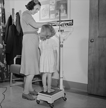 Young Girl's Height Being Measured at Health Center, Southington, Connecticut, USA, Fenno Jacobs for Office of War Information, May 1942