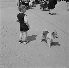 Small Boy with Dog on Leash, Southington, Connecticut, USA, Fenno Jacobs for Office of War Information, May 1942