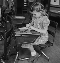 Young Girl Studying in Class, Southington, Connecticut, USA, Fenno Jacobs for Office of War Information, May 1942
