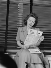 Woman Reading Government Literature Regarding Rationing and Salvaging during World War II, Ann Rosener for Office for Emergency Management, February 1942
