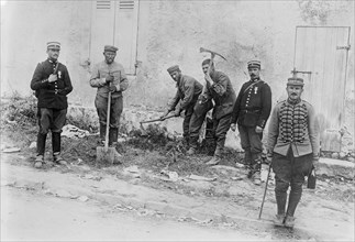 German Prisoners Working on Road between Villeroy and Neufmontiers, France during World War I, Bain News Service, 1914