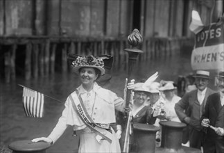 Mina van Winkle with Suffrage Torch on Tugboat during 'Handing of the Torch of Victory' Demonstration, Jersey City, New Jersey, USA, Bain News Service, August 1915