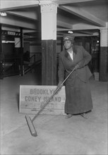 Female Subway Porter Cleaning Station, New York City, New York, USA, Bain News Service, 1917