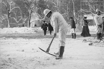 Man Clearing Snow from Street with Pickaxe, New York City, New York, USA, Bain News Service, January 1908