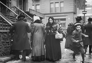 Woman Carrying Christmas Dinner Baskets from Salvation Army, New York City, New York, USA, Bain News Service, December 1908