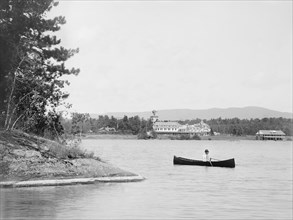Man in Canoe with Saranac Inn in Background, Upper Saranac Lake, New York, USA, William Henry Jackson for Detroit Publishing Company, 1902