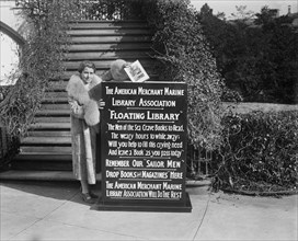 First Lady Grace Coolidge Dropping First Book into Box That Started Drive by American Merchant Marine Library Association for "Floating Library" for Sailors, Washington DC, USA, Harris & Ewing, Januar...