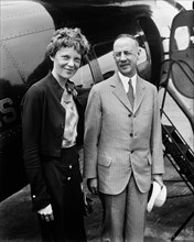 Amelia Earhart (L), Portrait with Man in front of Airplane, Harris & Ewing, 1932