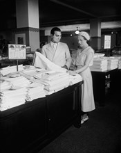 Salesman Helping Customer with Linens, Harris & Ewing, 1933