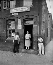 Street Scene, Three People Standing in front of Store, Washington DC, USA, Harris & Ewing, 1935