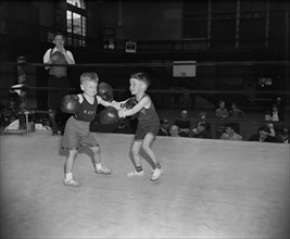 Wesley Hogan and Donald Fravel, both 6 years old, during Boxing Match, Navy Junior Boxing Championships for Sons of Naval Officers, Annapolis, Maryland, USA, Harris & Ewing, April 1939