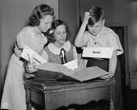 Three Children Studying Words during 16th National Spelling Bee Competition Sponsored by Louisville Courier-Journal, Washington DC, USA, Harris & Ewing, May 1940
