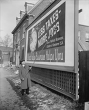 Man Putting Up Anti-Tax Sign, Washington DC, USA, Harris & Ewing, January 1939