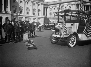 Man Pulling Bus with Teeth outside U.S. Capitol Building, Washington DC, USA, Harris & Ewing, 1921