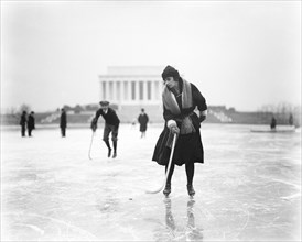 Woman Ice Skating with Hockey Stick with Lincoln Memorial in Background, Washington DC, USA, Harris & Ewing, January 1922