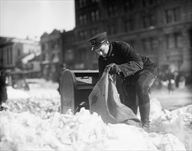 Mailman Collecting Mail from Mailbox after Blizzard, Washington DC, USA, Harris and Ewing, January 1922