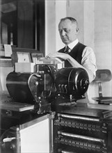 Worker Operating Tabulating Machine, Census Bureau, Department of Commerce, Washington DC, USA, Harris & Ewing, 1919