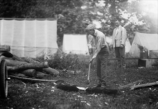 Henry Ford Chopping Wood at Campsite, Maryland, USA, Harris & Ewing, 1921