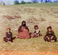 Kurd Woman sitting with Children in Field, Artvin, Turkey, Prokudin-Gorskii Collection, 1910