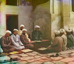 Group of Men with Books Seated Around Carpet in Courtyard of Mosque, Samarkand, Uzbekistan, Russian Empire, Prokudin-Gorskii Collection, 1910