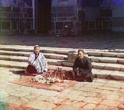 Portrait of Two Seated Men on Carpet with Display of Bottles, Sarmakand, Uzbekistan, Russian Empire, Prokudin-Gorskii Collection, 1910