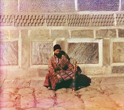 Portrait of Man Seated with Water Pipe next to Ornate Wall, Samarkand, Uzbekistan, Russian Empire, Prokudin-Gorskii Collection, 1910