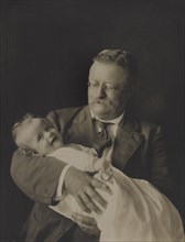 Theodore Roosevelt, Portrait holding Grandson Kermit Roosevelt, Jr., 1916