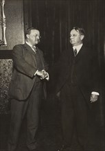 Theodore Roosevelt and Hiram Johnson, full-length Portrait Shaking Hands after being nominated as Presidential and Vice Presidential Candidates for the Progressive or Bull-Moose Party, 1912