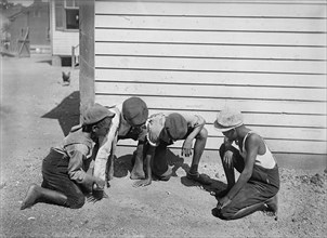 Group of Young Boys Playing Game of Dice on Side of Building, Detroit Publishing Company, 1901