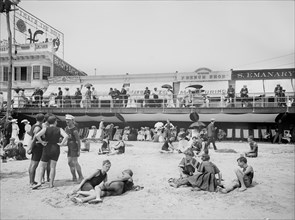 Beachgoers with Boardwalk in Background, Atlantic City, New Jersey, USA, Detroit Publishing Company, 1904