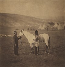 British Colonel George Clarke, Royal Scots Greys, Full-length Portrait, wearing uniform, Standing beside his Wounded Horse, Sultan and another Man with Encampment of Tents in Background, Crimean War, ...