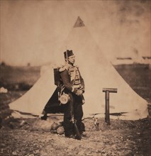 British Soldier, Full-Length Portrait in Full Marching Order with Military Tent in Background, Crimean War, Crimea, Ukraine, by Roger Fenton, 1855
