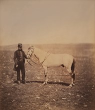 British Captain Edward Stanton, Full-Length Portrait in Uniform Standing Next to Horse, Crimean War, Crimea, Ukraine, by Roger Fenton, 1855