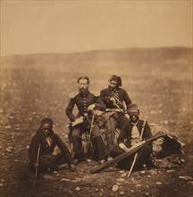 Mr. Justus Thompson, of the Commissariat, Full-Length Portrait, Sitting on a Gabion, Surrounded by Attendants of Ismail Pacha, Crimean War, Crimea, Ukraine, by Roger Fenton, 1855