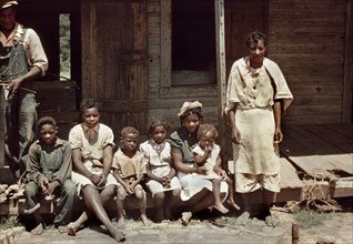 Family Portrait on Porch, Bayou Bourbeau Plantation, FSA, Cooperative, Natchitoches, Louisiana, USA, Marion Post Wolcott for Farm Security Administration, August 1940
