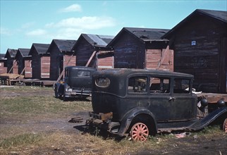 Row of Homes Condemned by Board of Health that are Still Occupied by African-American Migratory Workers, Belle Glade, Florida, USA, Marion Post Wolcott for Farm Security Administration, January 1941