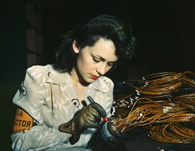 Female Aircraft Worker Checking Electrical Assemblies, Vega Aircraft Corporation, Burbank, California, USA, David Bransby for Office of War Information, June 1942