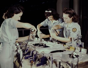 Three Female Workers Drilling Wing Bullhead for Transport Plane, Consolidated Aircraft Corporation, Fort Worth, Texas, USA, Howard R. Hollem for Office of War Information, October 1942