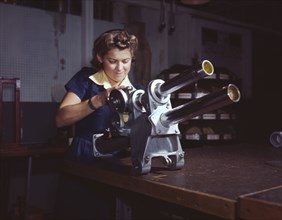 Young Woman Working on Landing Gear Mechanism of P-51 Fighter Plane, North American Aviation, Inc., Inglewood, California, USA, Alfred T. Palmer for Office of War Information, October 1942